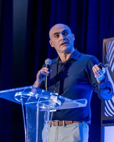 Luis Lastras of IBM making a point beside the clear keynote podium