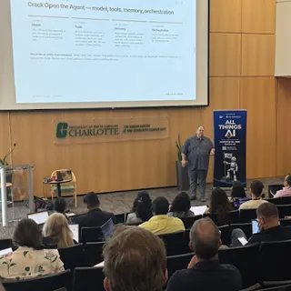 A lecture hall at Build an Agent Day in Charlotte, slides on screen